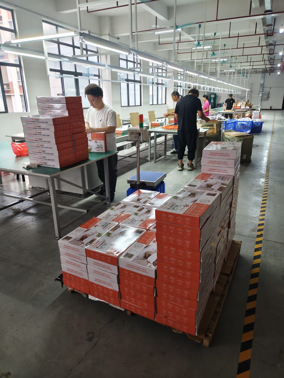 Patient lift packaging line preparing export cartons