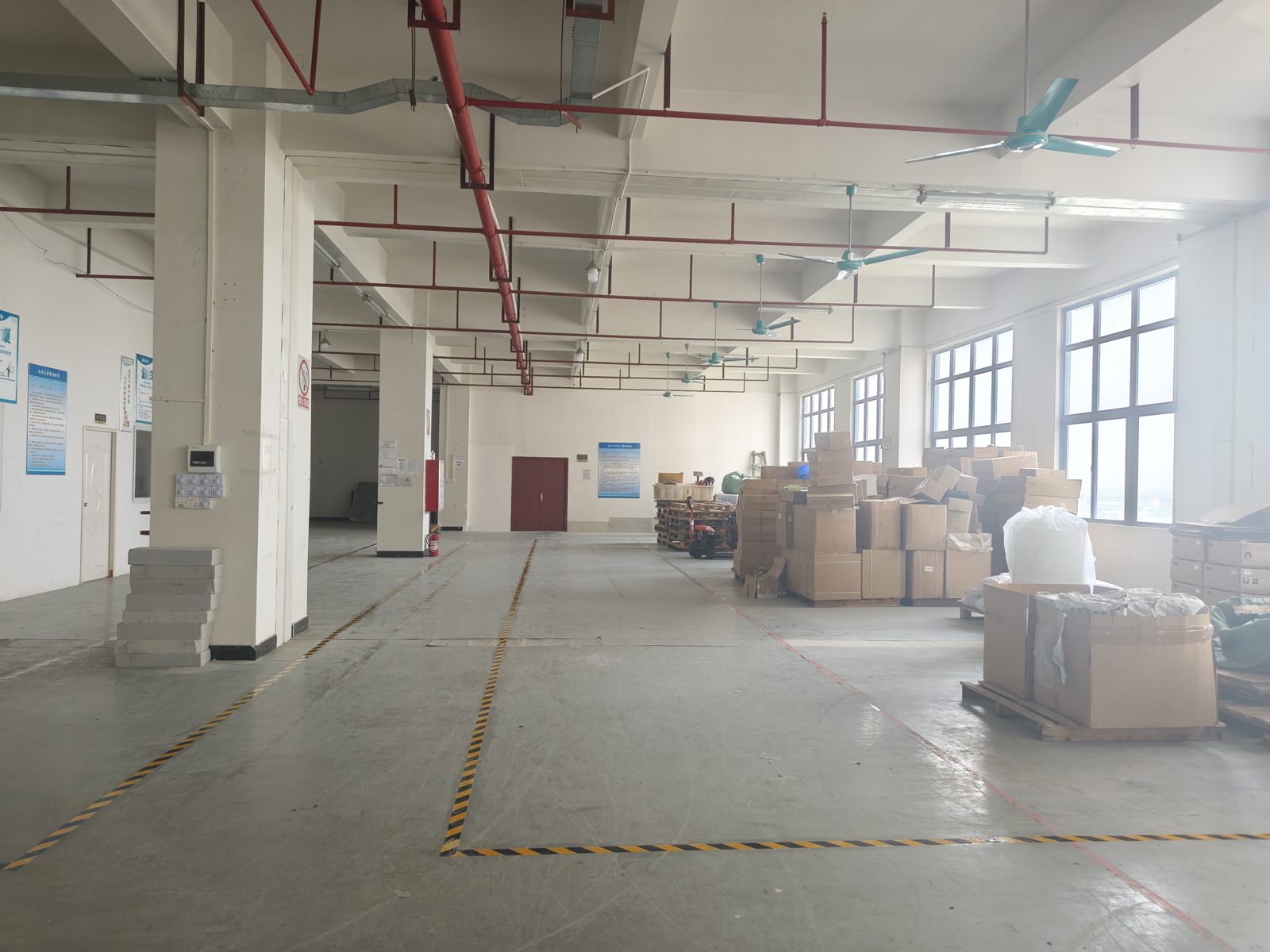 Finished patient lifts staged in the factory storage area