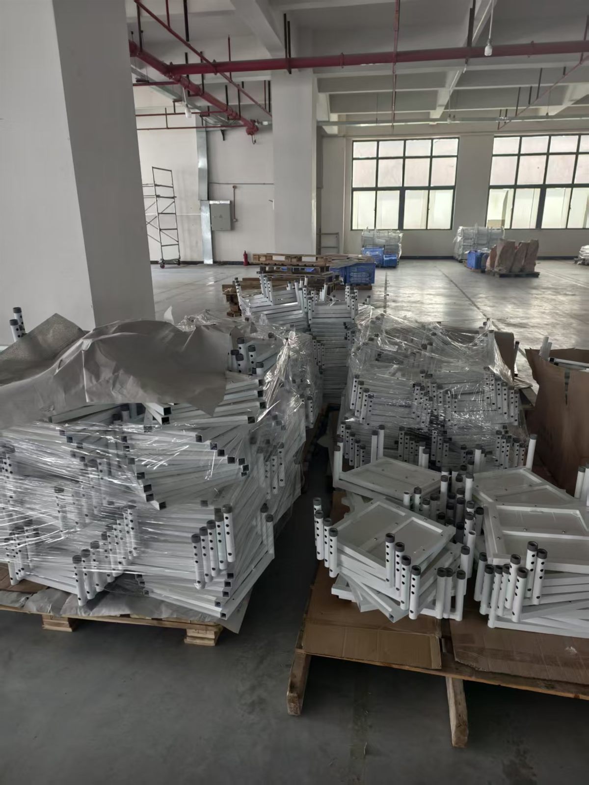 Patient lift frame parts staged in the workshop
